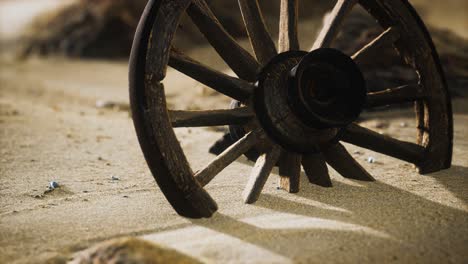 Large-wooden-wheel-in-the-sand